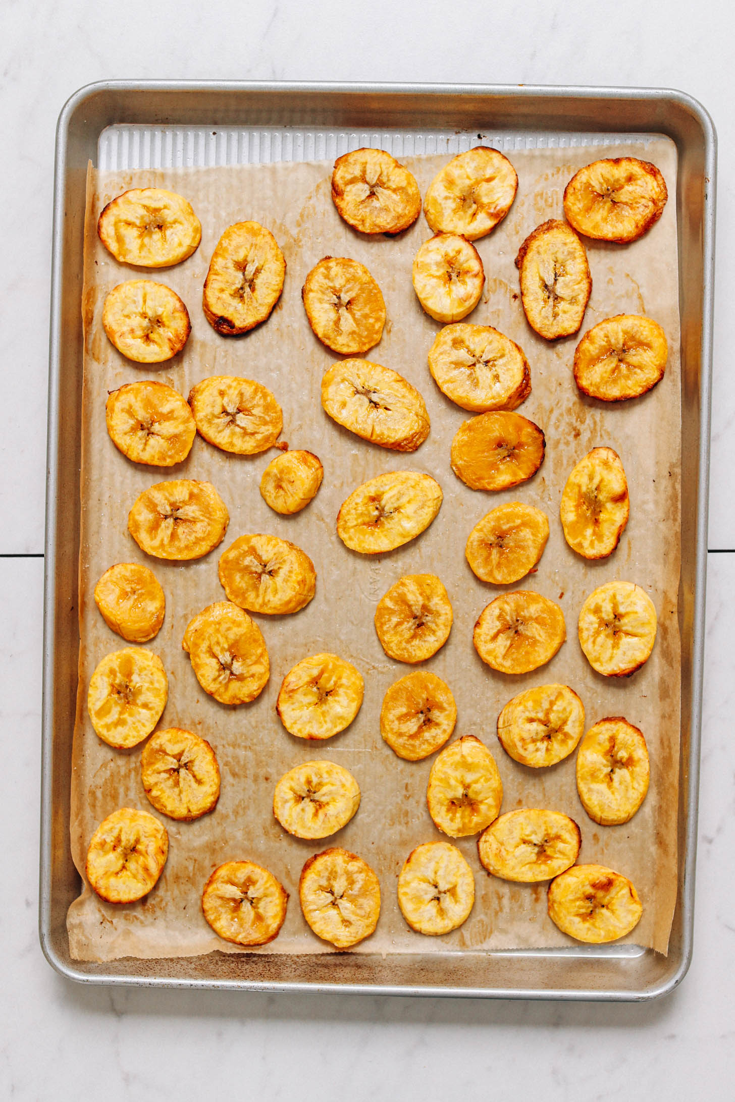Roasted plantains on a baking sheet