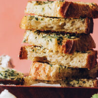 Slices of vegan garlic bread on a plate