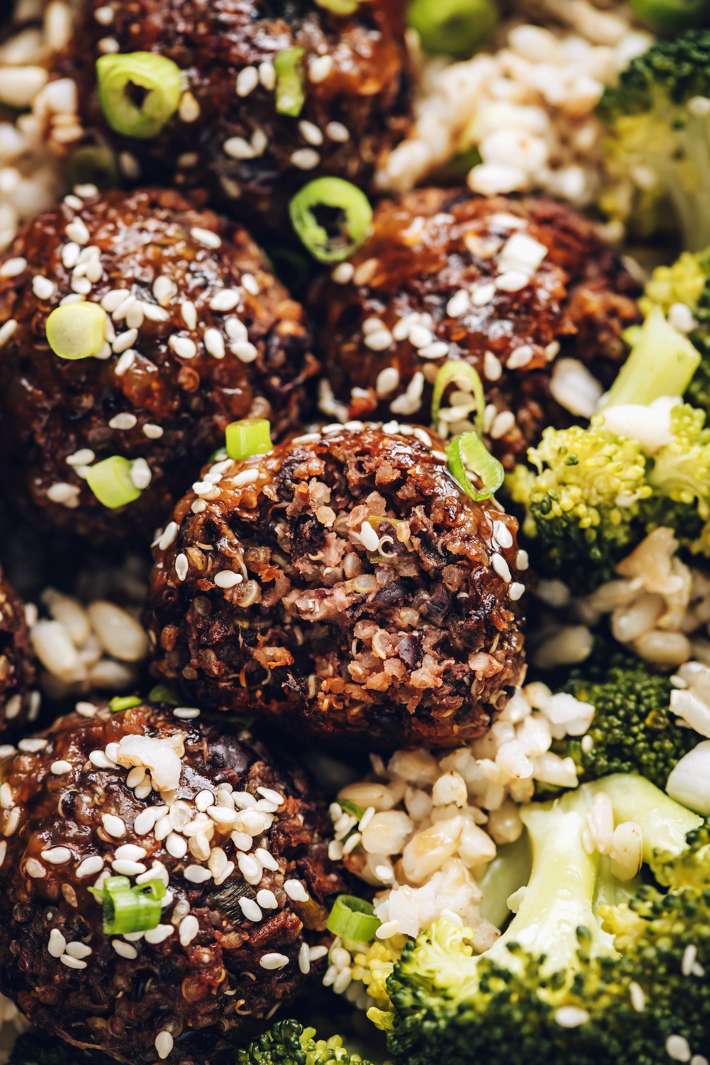 Close up shot of a ginger sesame vegan meatball with a bite taken out