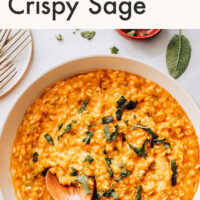 Pan of dairy-free pumpkin risotto with crispy sage