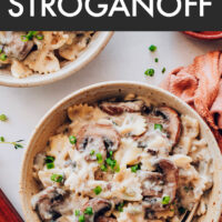 Bowl of creamy vegan mushroom stroganoff with a spoon in it