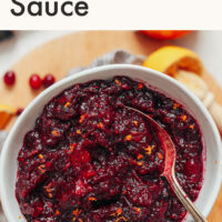 Bowl of easy 3-ingredient cranberry sauce with a spoon in it