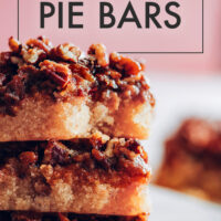 Stack of vegan and gluten-free pecan pie bars