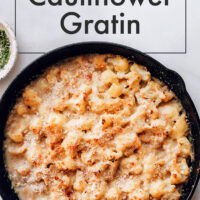 Skillet of vegan and gluten-free creamy cauliflower gratin