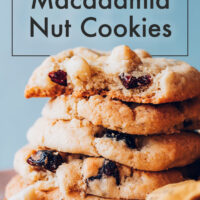 Stack of vegan and gluten-free cranberry macadamia nut cookies