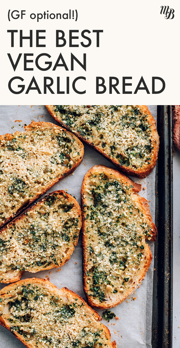Slices of vegan garlic bread on a baking sheet