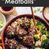 A bowl of vegan and gluten-free ginger sesame meatballs with broccoli and brown rice