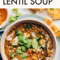 Bowl of vegan and gluten-free Instant Pot Curried Lentil Soup with cilantro on top