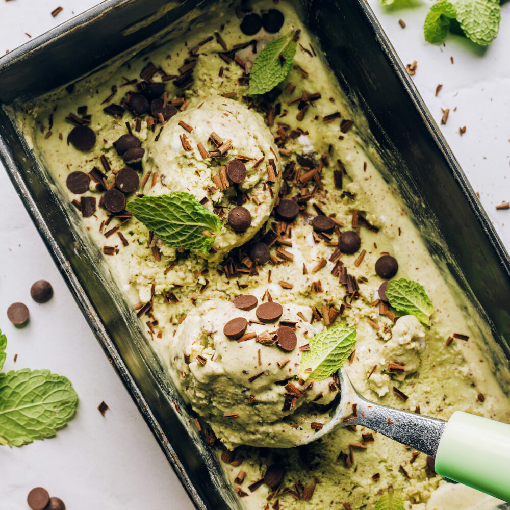 Scoops of vegan mint chocolate chip ice cream in a pan