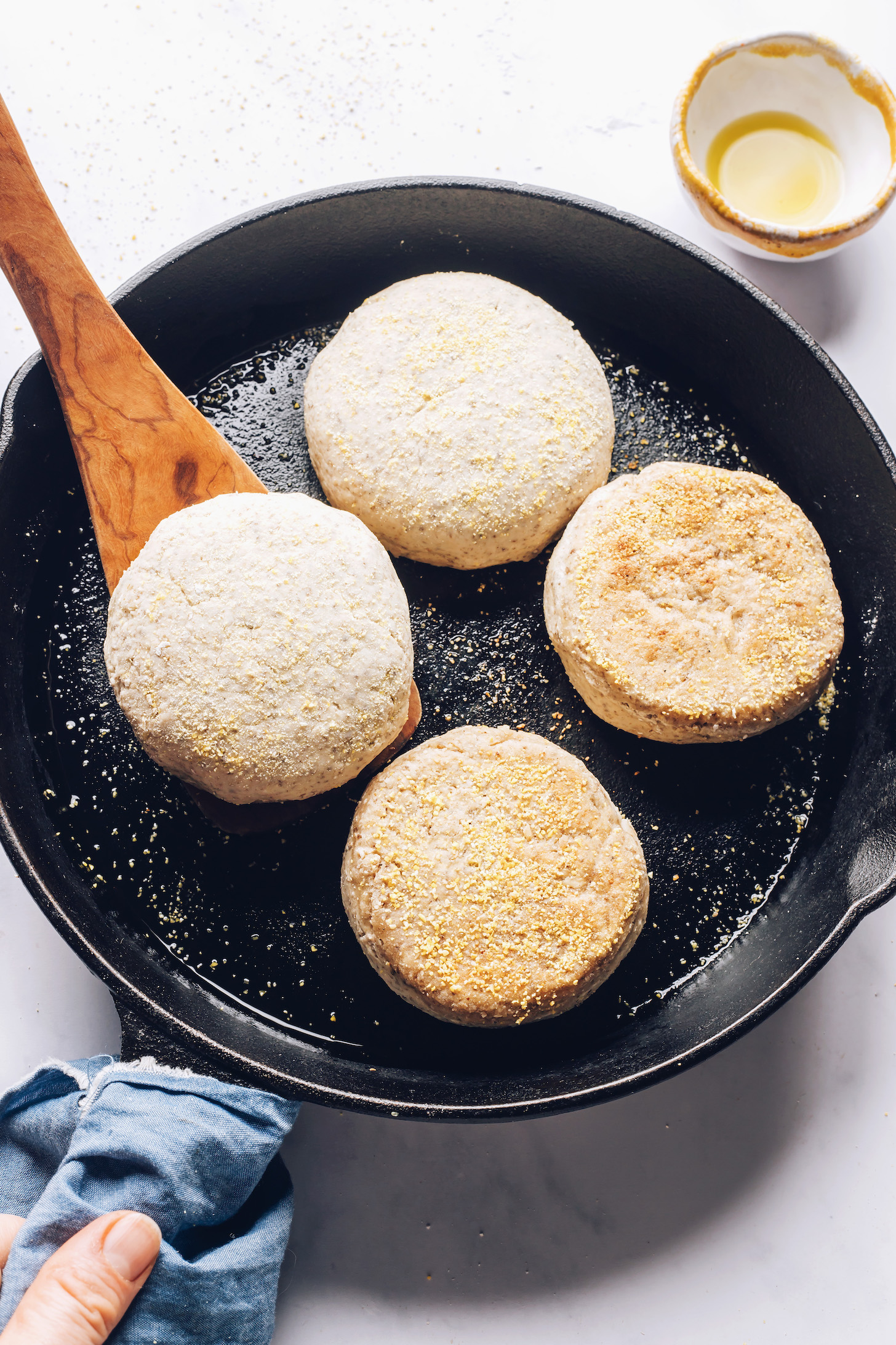 Cooking gluten-free English muffins in a cast iron skillet