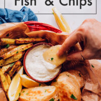 Basket of vegan and gluten-free "fish" and chips with a side of vegan tartar sauce