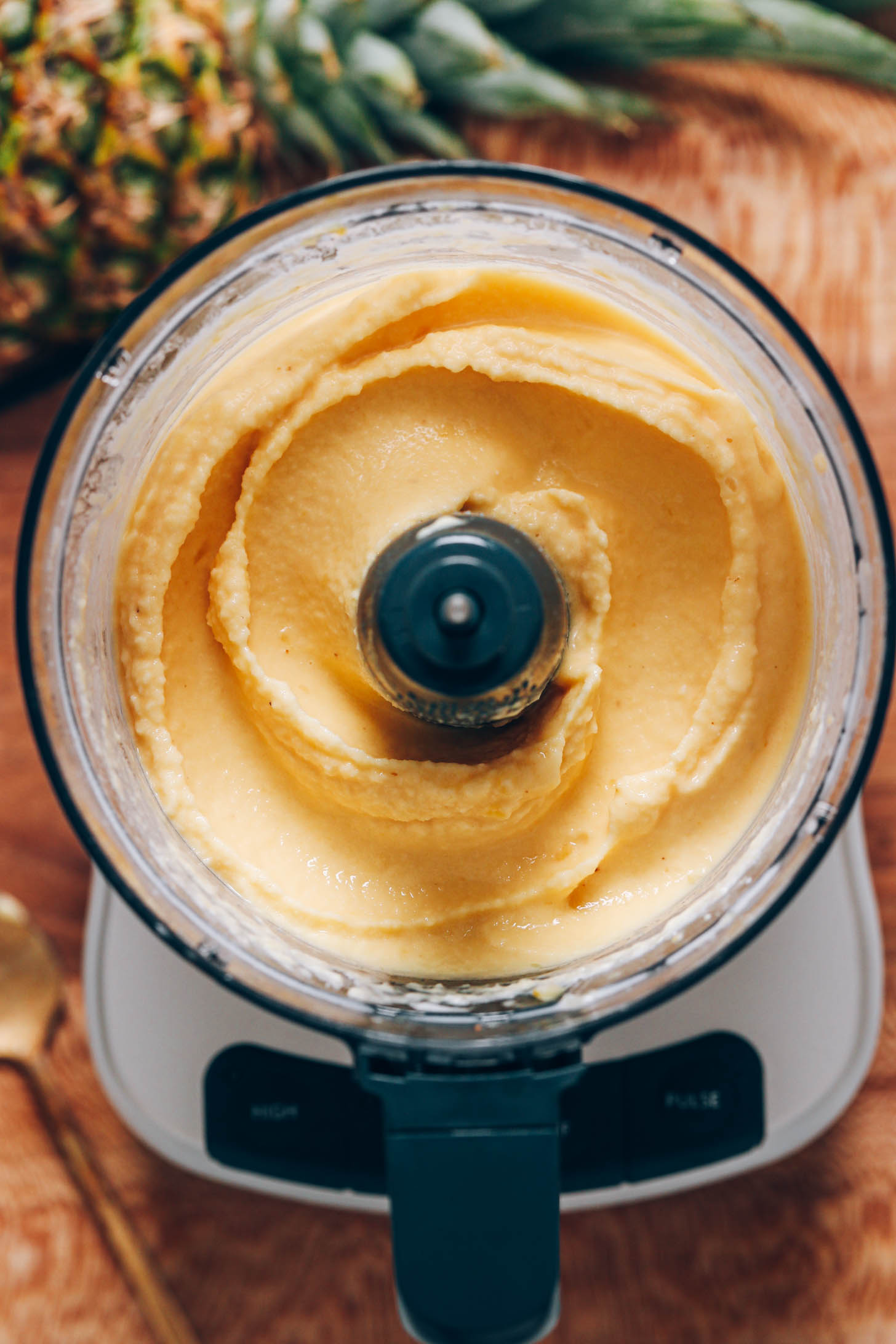 Creamy dole whip-inspired pineapple sorbet in a food processor