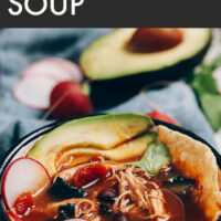 Bowl of easy chicken tortilla soup with avocado slices on top