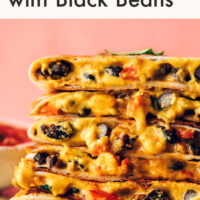 Stack of vegan quesadillas with smoky black beans