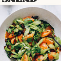 Bowl of our vibrant celery salad with dates and pistachios