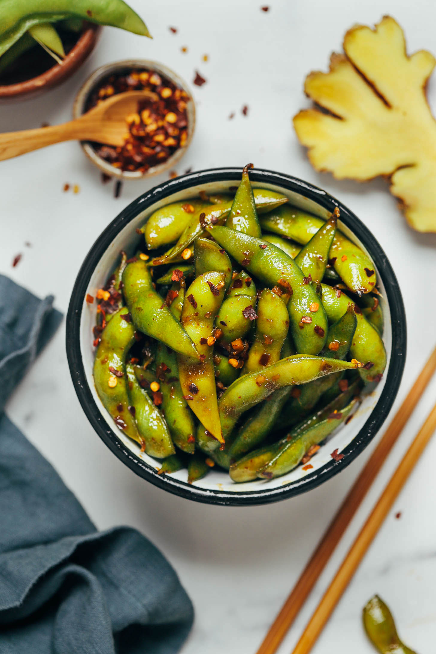 Bowl of cooked spicy garlic edamame pods