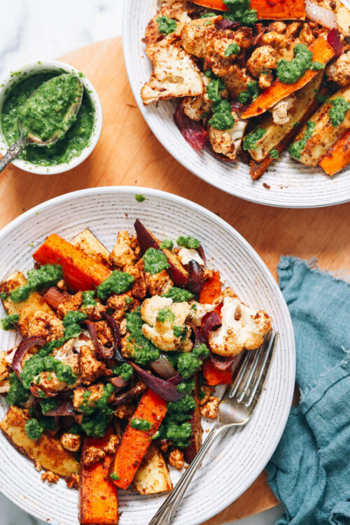 Two serving bowls filled with our tandoori masala sheet pan dinner recipe