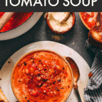 Bowl of vegan and gluten-free super garlicky tomato soup with smashed white beans