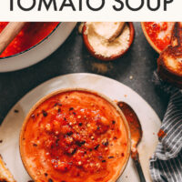 Bowl of vegan and gluten-free super garlicky tomato soup with smashed white beans