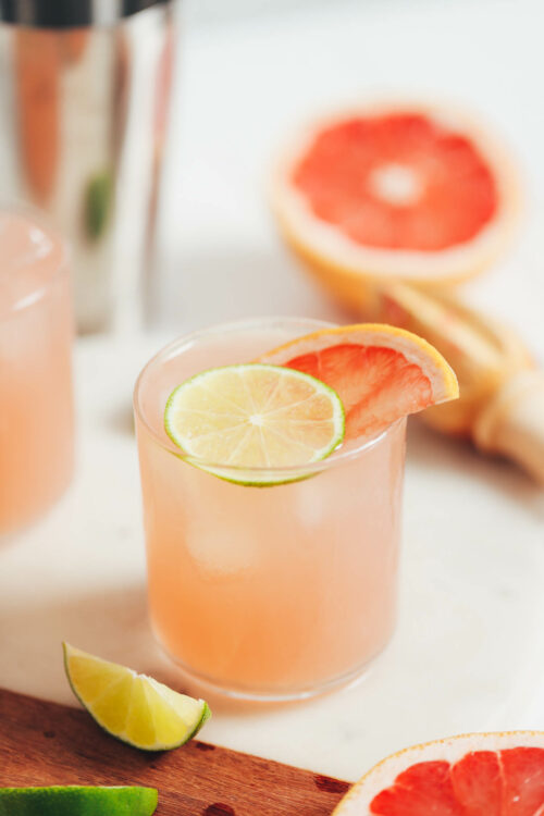Glass of a grapefruit lime spritzer on a cutting board