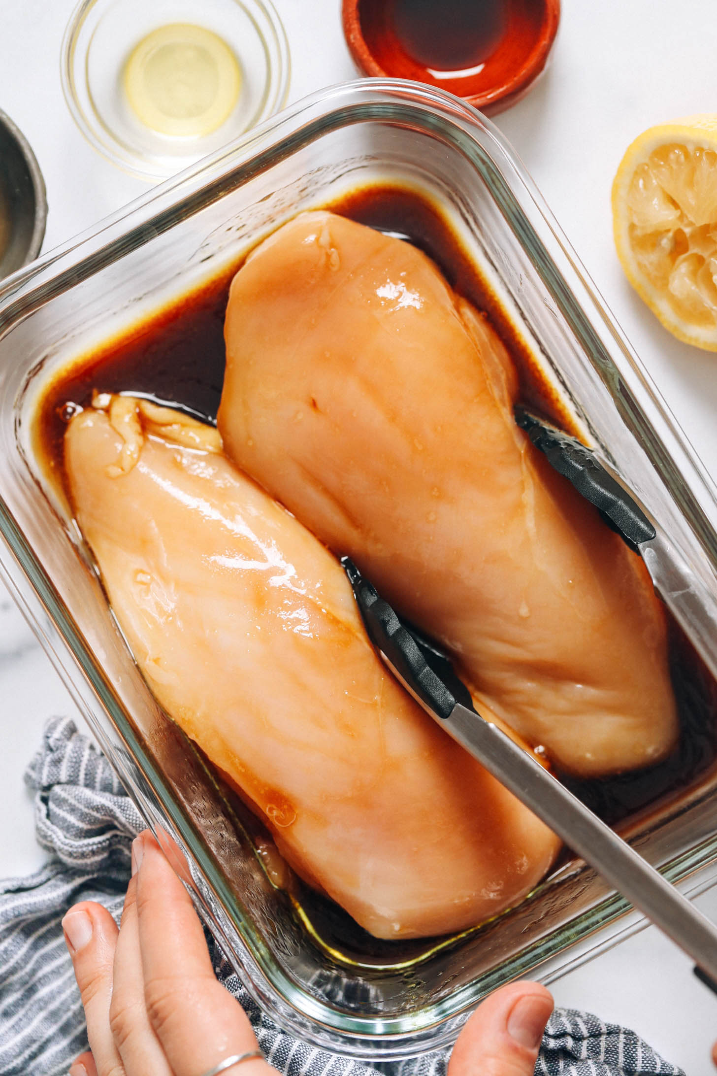 Marinating chicken breasts in a glass dish