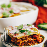 Plate and baking dish of our green enchilada bake recipe