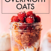 Jar of vegan and gluten-free decadent chocolate overnight oats with raspberries on top