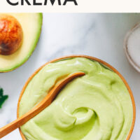 Spoon in a bowl of easy vegan avocado crema