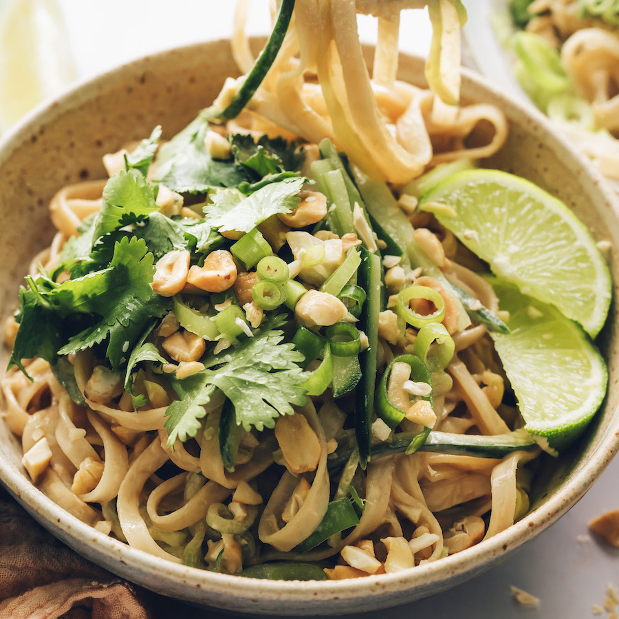 Lime, cilantro and peanuts in a bowl of our sesame noodle salad recipe