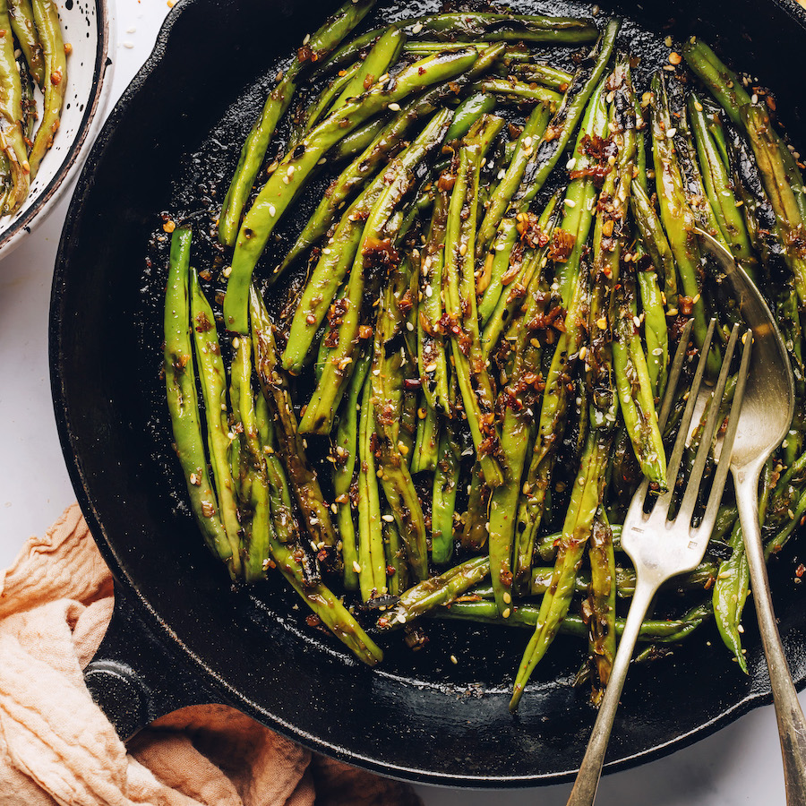 Cast iron skillet filled with spicy stir-fried green beans