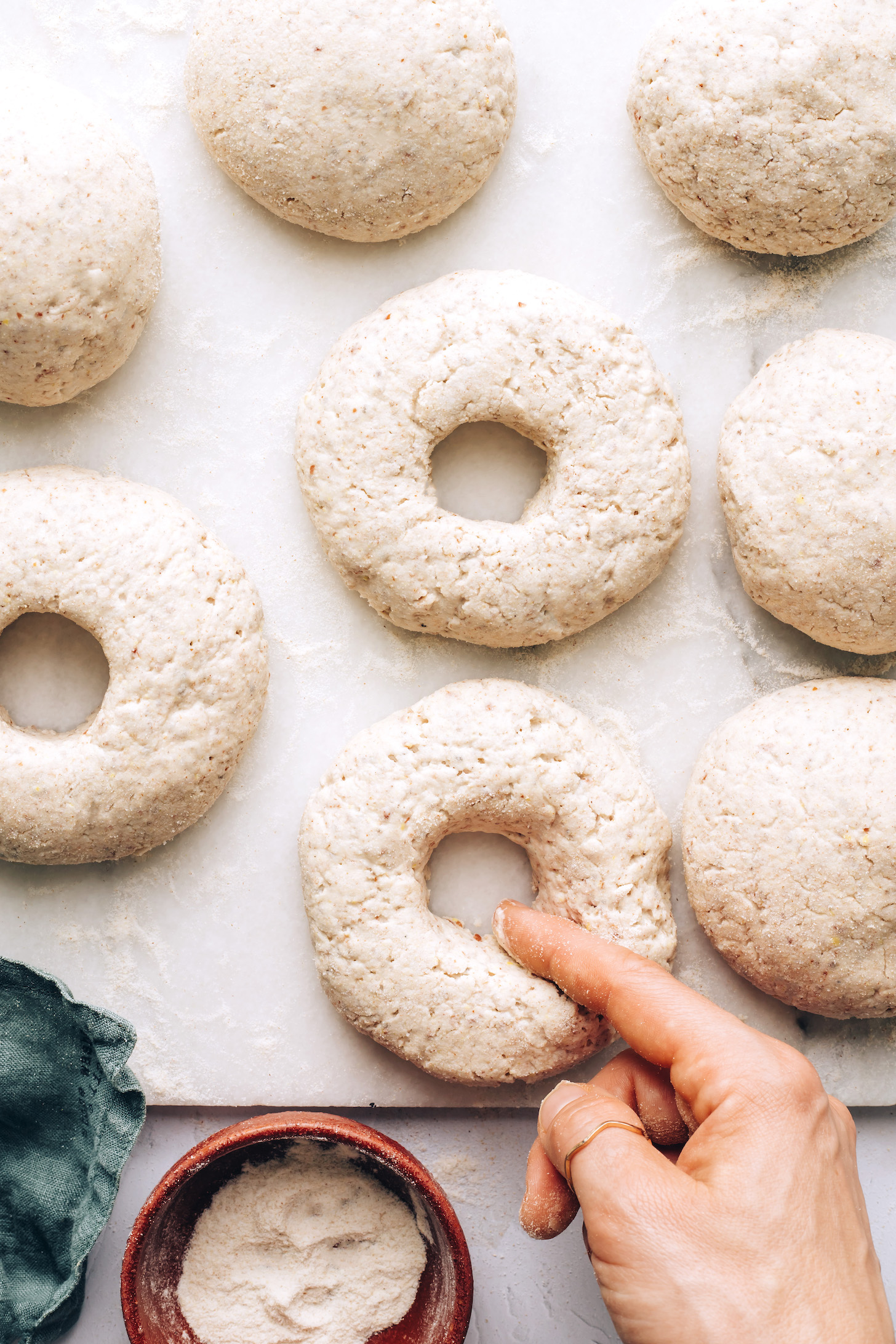 Forming bagel dough into bagel shapes