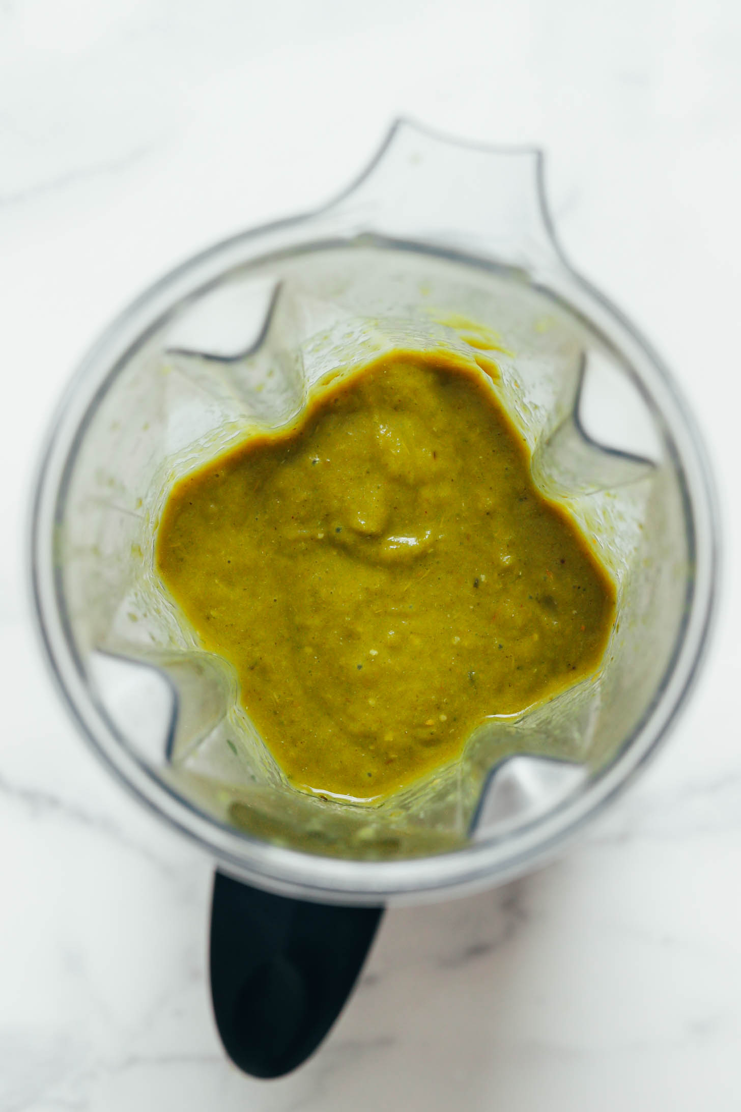 Thick green enchilada sauce in a blender