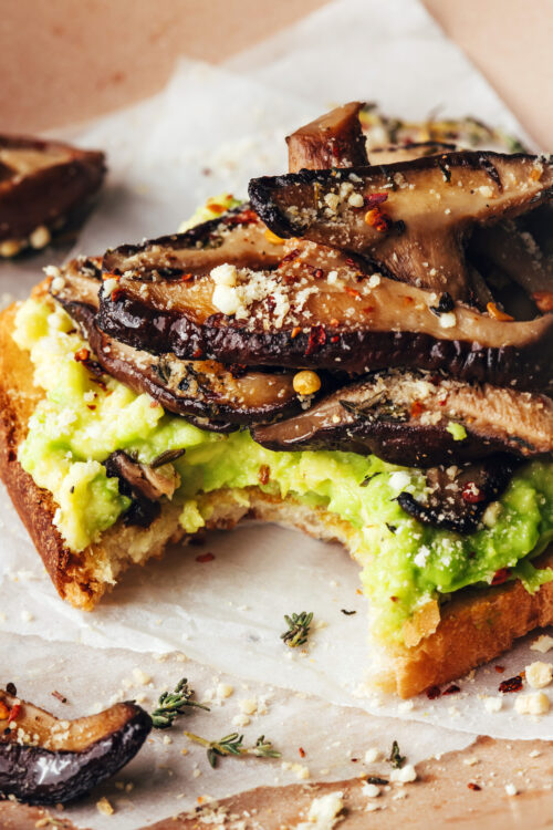 Close up shot of a slice of mushroom avocado toast