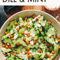 Bowl of vegan and gluten-free cucumber salad with fresh dill and mint