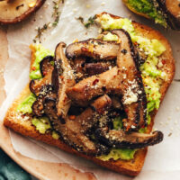Sautéed mushrooms on top of a slice of avocado toast