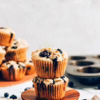 Stack of gluten-free blueberry muffins on a plate
