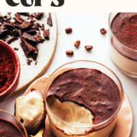 Jars of our easy vegan tiramisu pudding cups made with just 7 simple ingredients