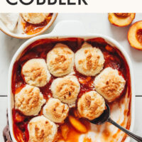 Pan of peach cobbler with text above it saying Easy Gluten-Free Peach Cobbler