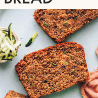 Slices of zucchini bread with text at the top saying The Best Vegan Gluten-Free Zucchini Bread