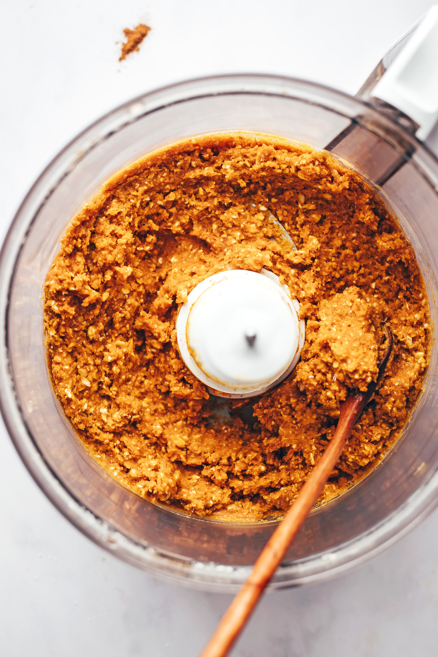 Peanut butter pumpkin oat mixture in a food processor