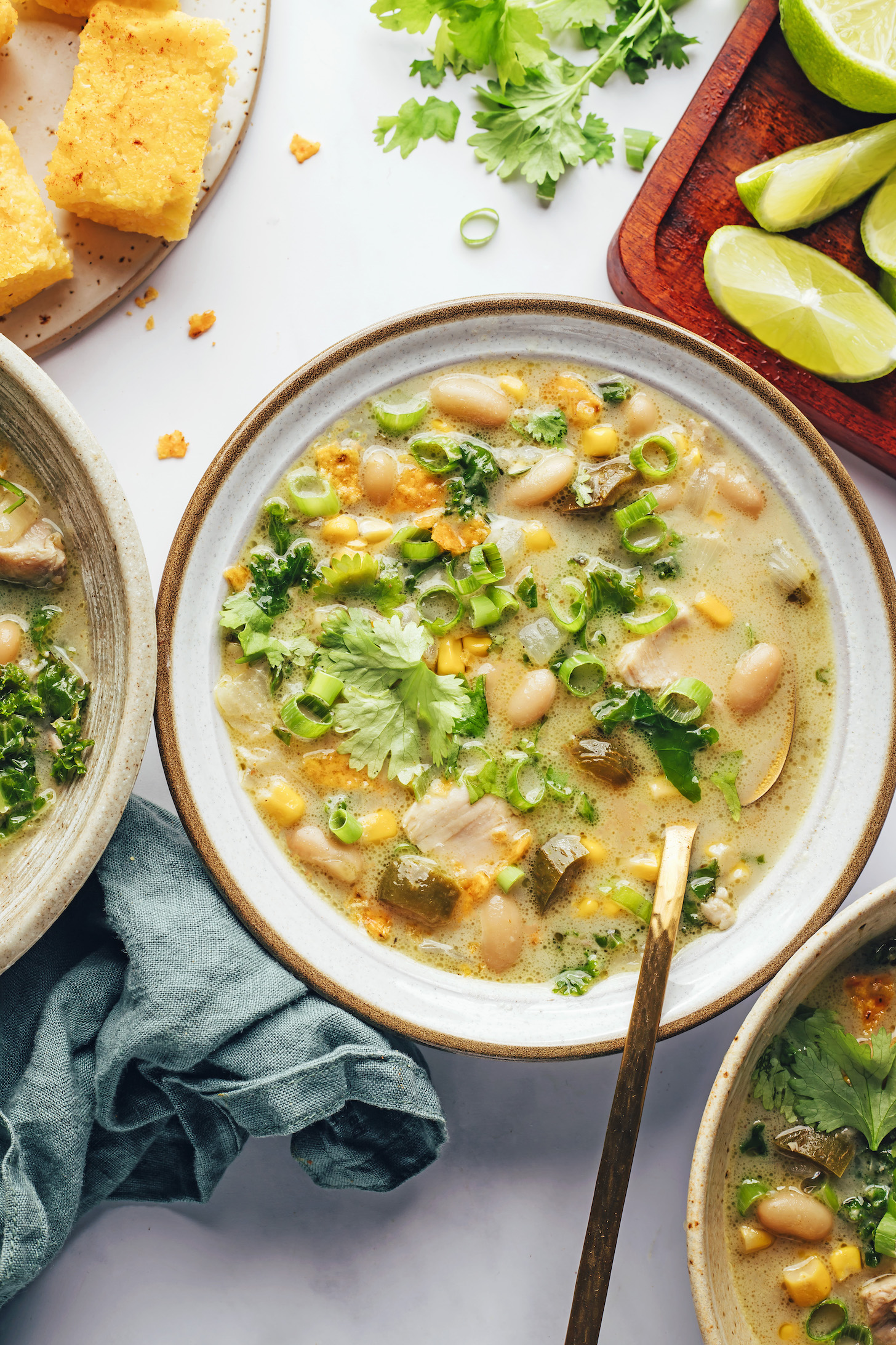 Bowl of white bean chicken chili topped with cilantro and green onion