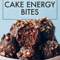 Bowl of German Chocolate Cake Energy Bites with the top one having a bite taken out to show the texture