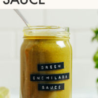 Jar of enchilada sauce with text above it saying easy green enchilada sauce only 8 ingredients