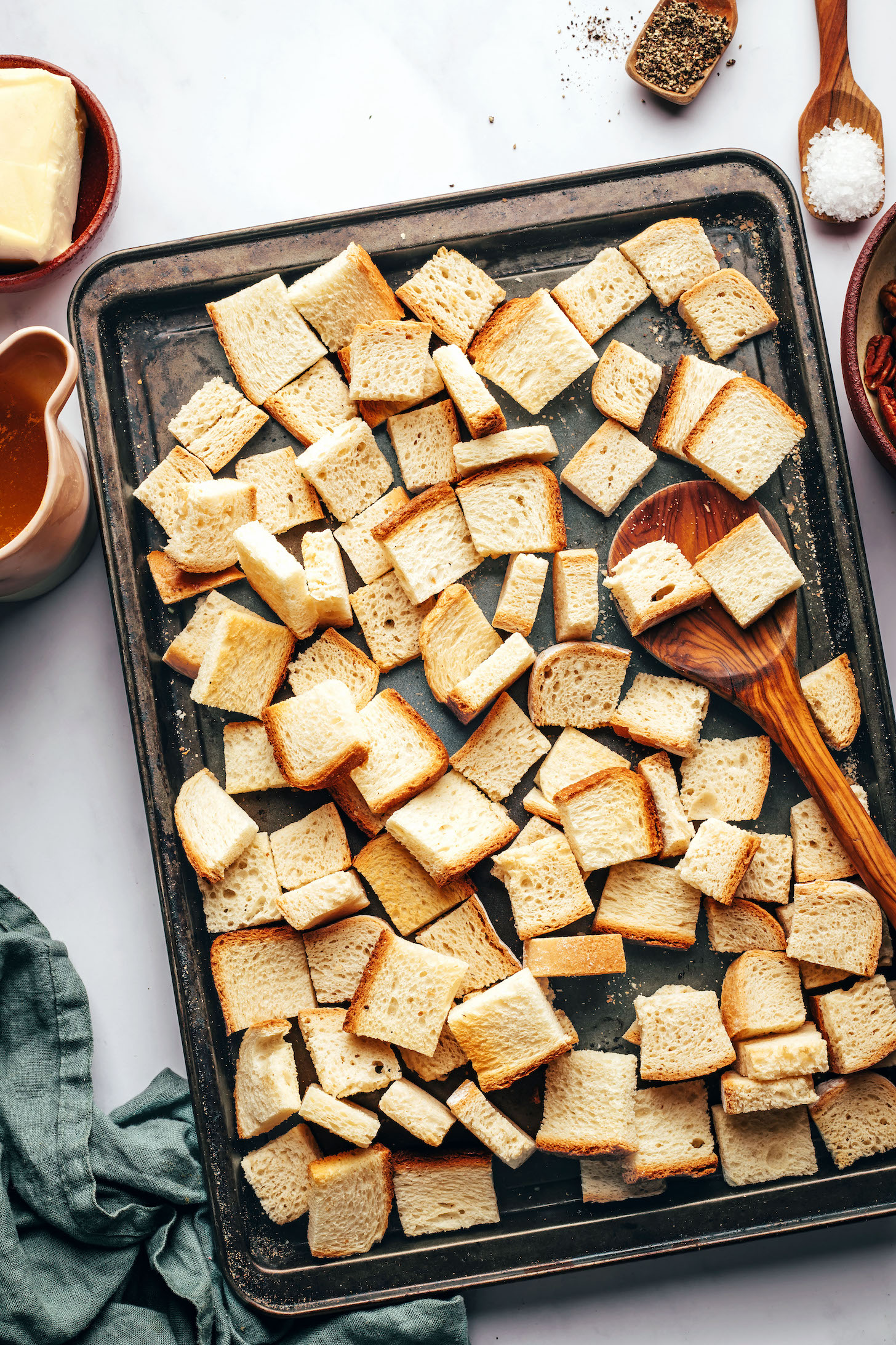 Cubed bread on a baking sheet
