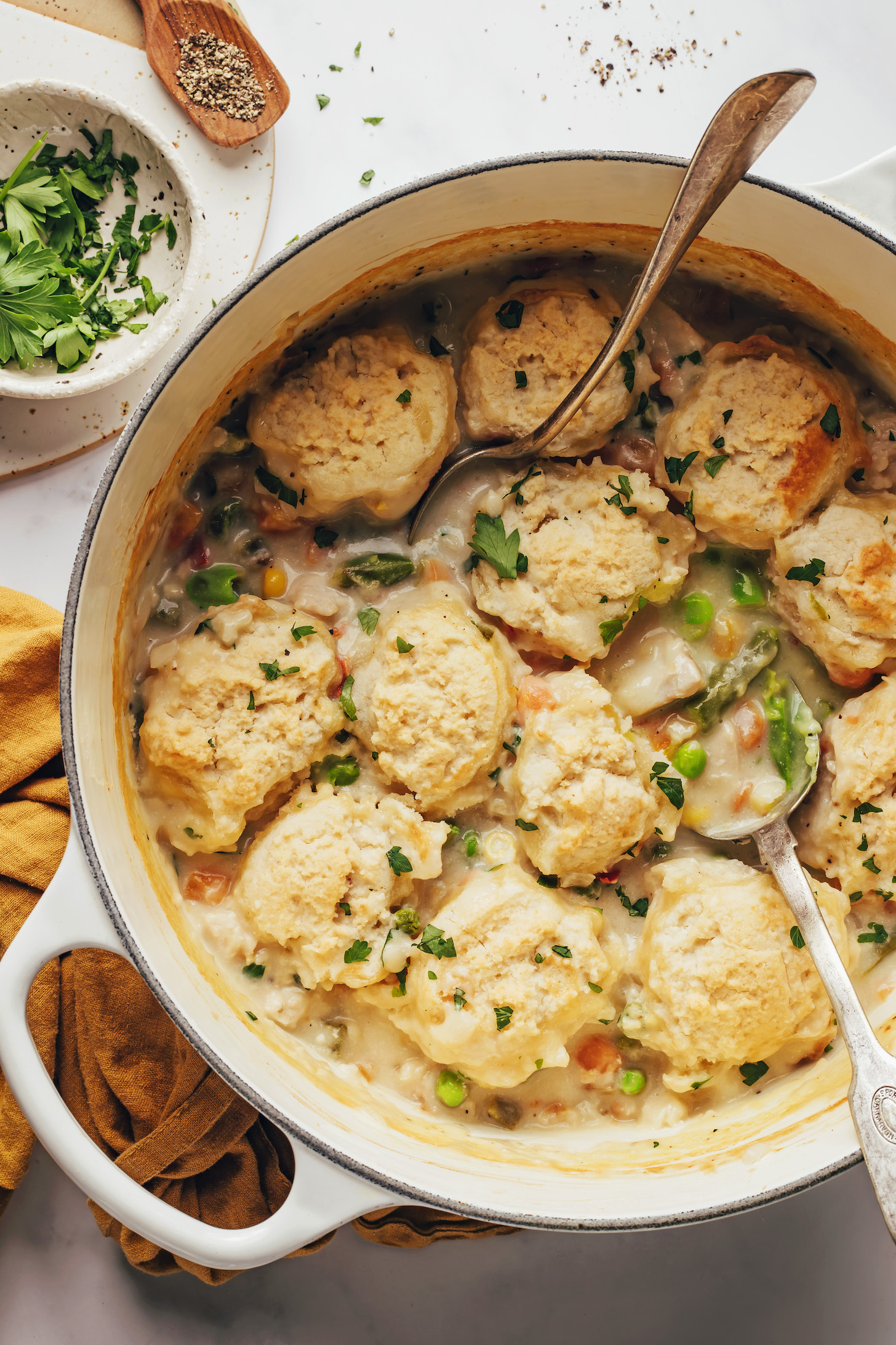 Lightly browned gluten-free and dairy-free biscuits over chicken pot pie soup
