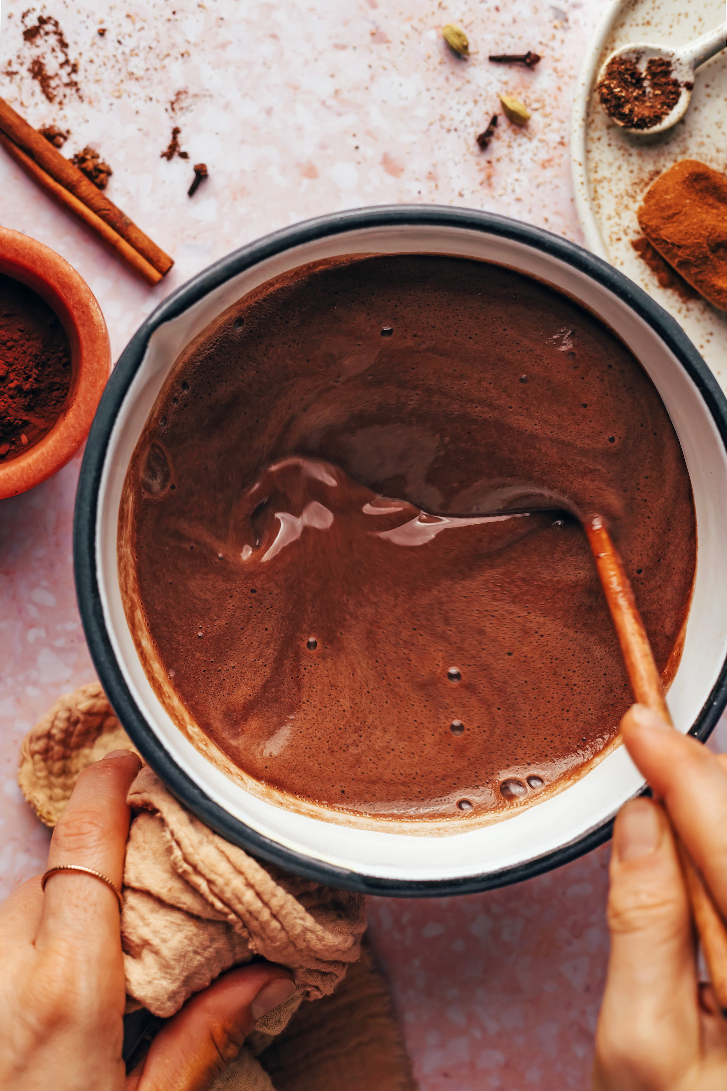 Stirring a pot of chai hot chocolate