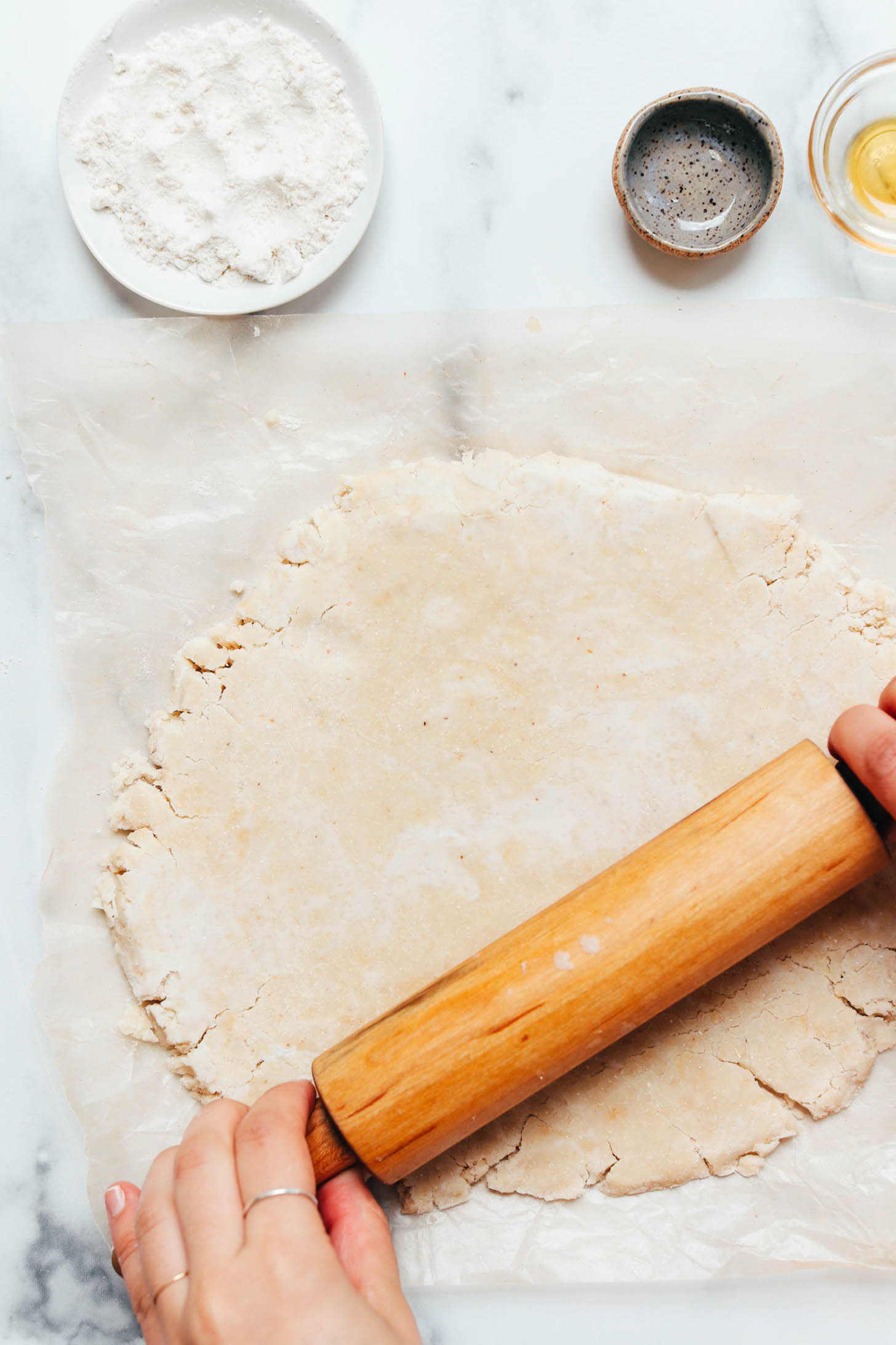 Using a rolling pin to roll out pie crust