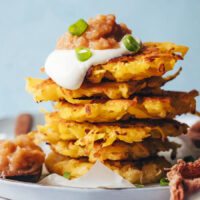 Vegan gluten-free latkes in a stack with toppings