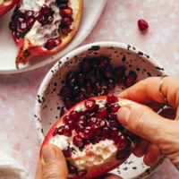Showing how to cut and open a pomegranate