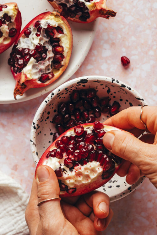 Showing how to cut and open a pomegranate